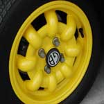 Minilite style rims from Italy. 13x6 powder coated in one of Chapman's favorite rim colors.