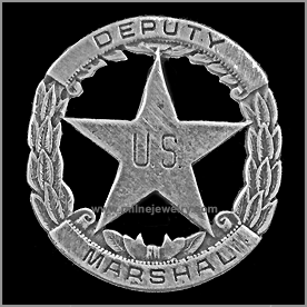 Deputy U.S. Marshall Old West Law Enforcement Badges. These replica badges are cast from a tin and zinc alloy, using molds made from the original, authentic badge, and has a pin soldered on the back. Special care and attention has been given to retaining every minute detail of the original badge. Copyright Milne Jewelry Company.