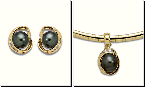 South Sea Pearl and Baguette Diamond Earrings Set in 14 Karat Gold.