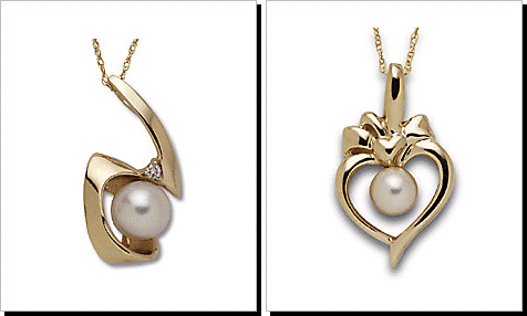 Freeform Cultured Pearl and Diamond Pendant Set in 14 Karat Gold.